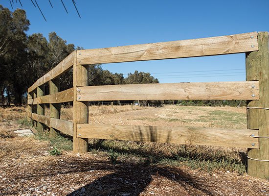 PERMAPole posts with treated timber rails